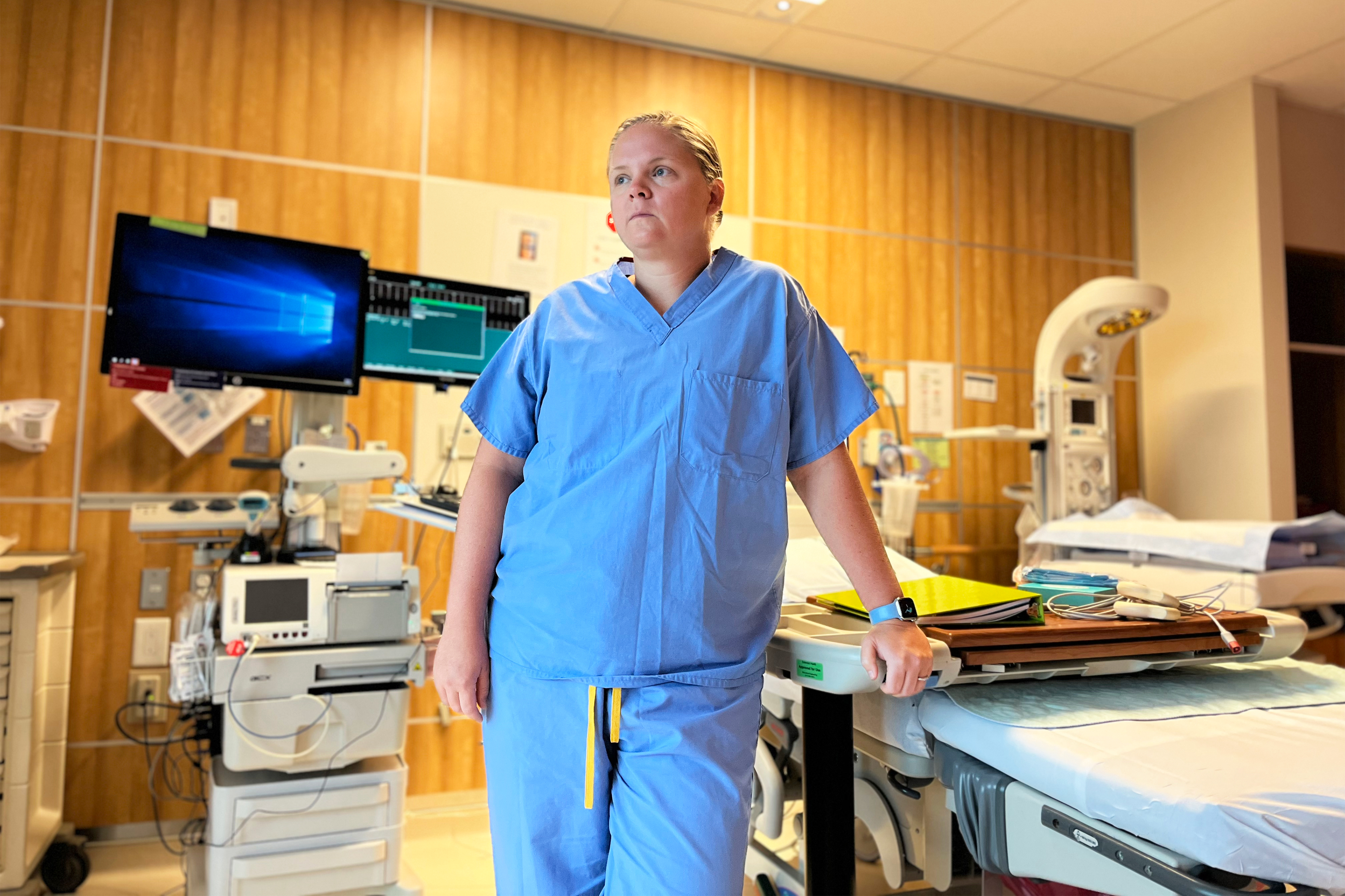 A photo shows Dr. Nicole Scott standing in a room surrounded by medical equipment.
