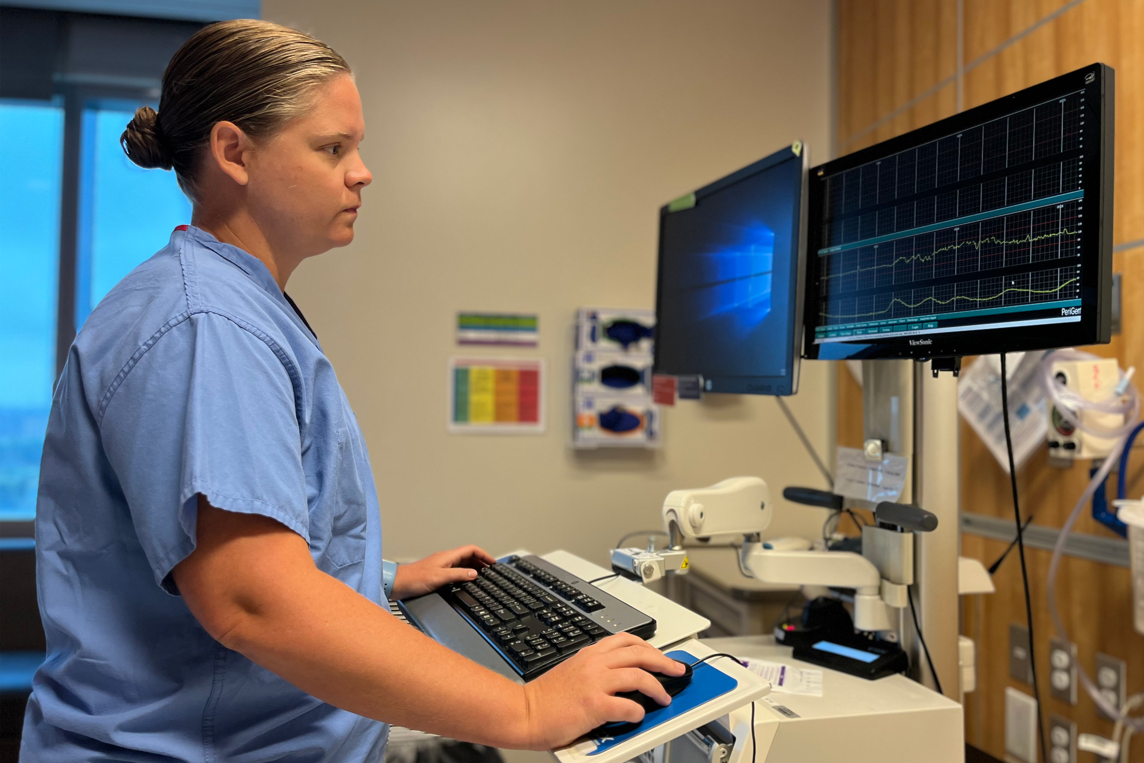 A photo shows Dr. Nicole Scott working at a computer.