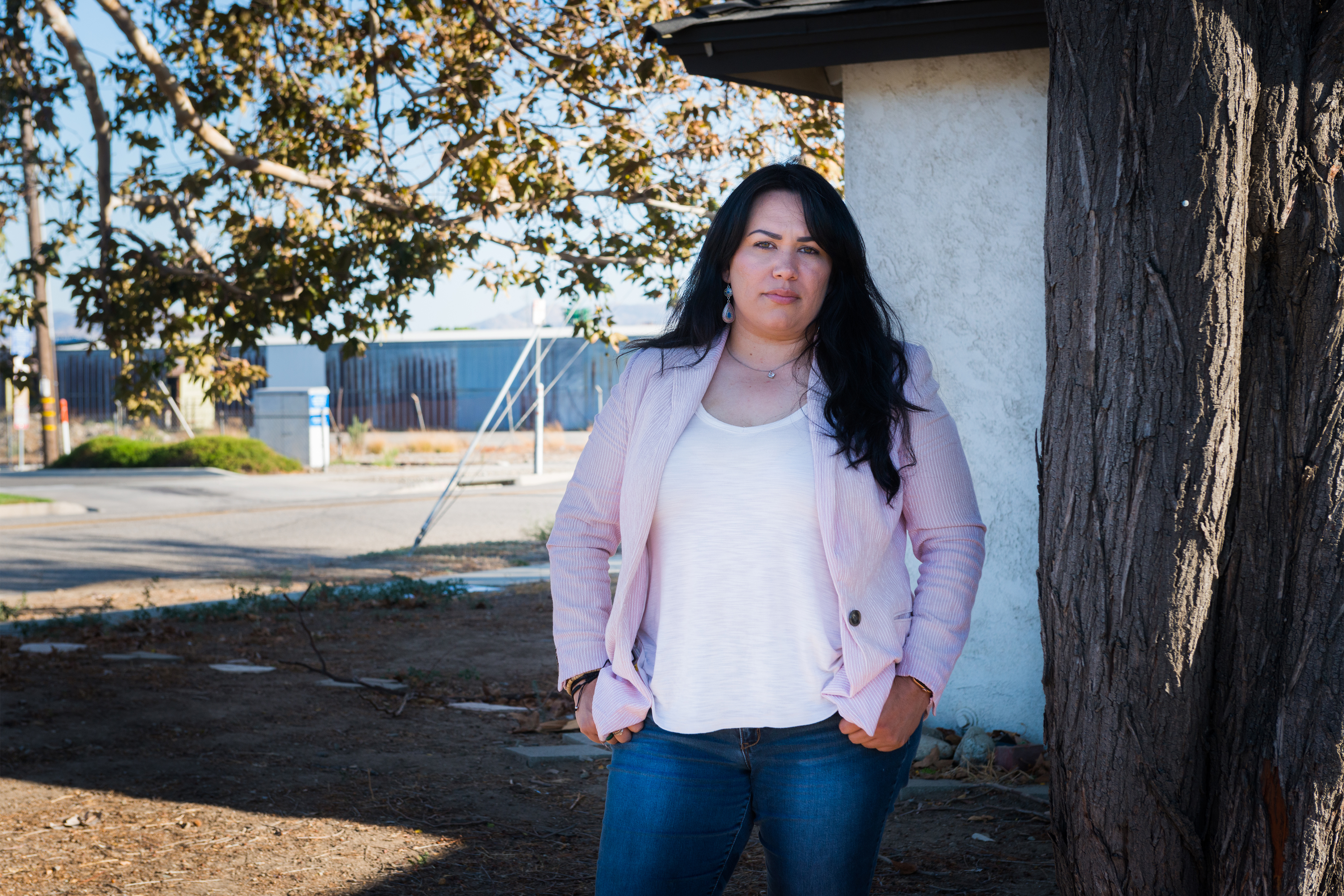 A photo shows Ana Gonzalez posing for a portrait outside of her home.