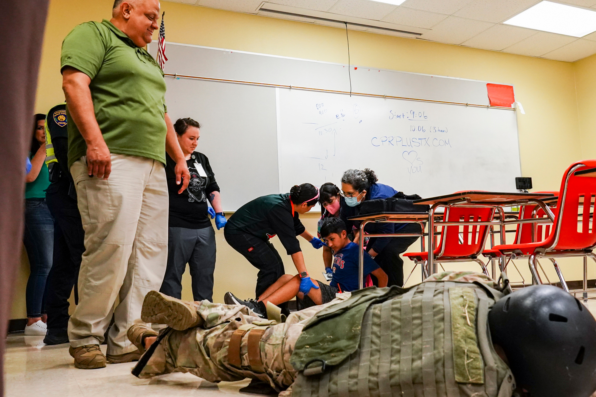 A photo shows staff from the Brownsville Independent School District participating in an active shooter drill.