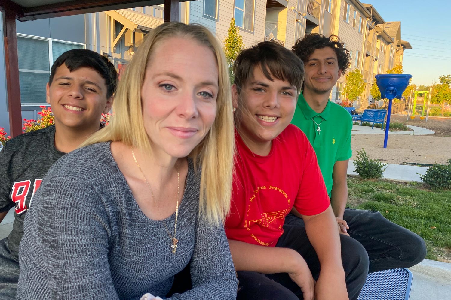 A photo shows GlendaRika Garcia sitting outside with her kids.
