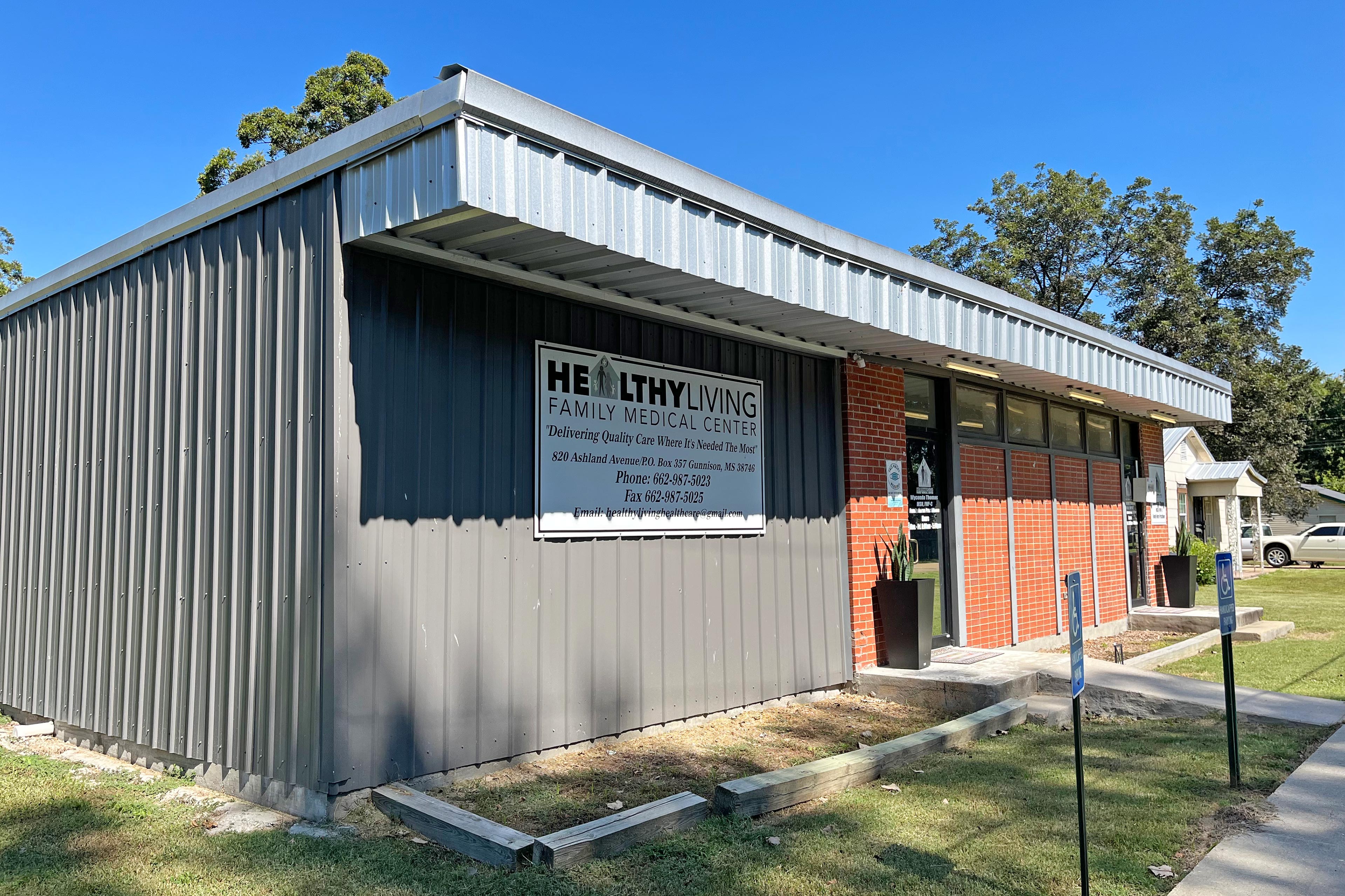 A photo shows the outside of Healthy Living Family Medical Center.