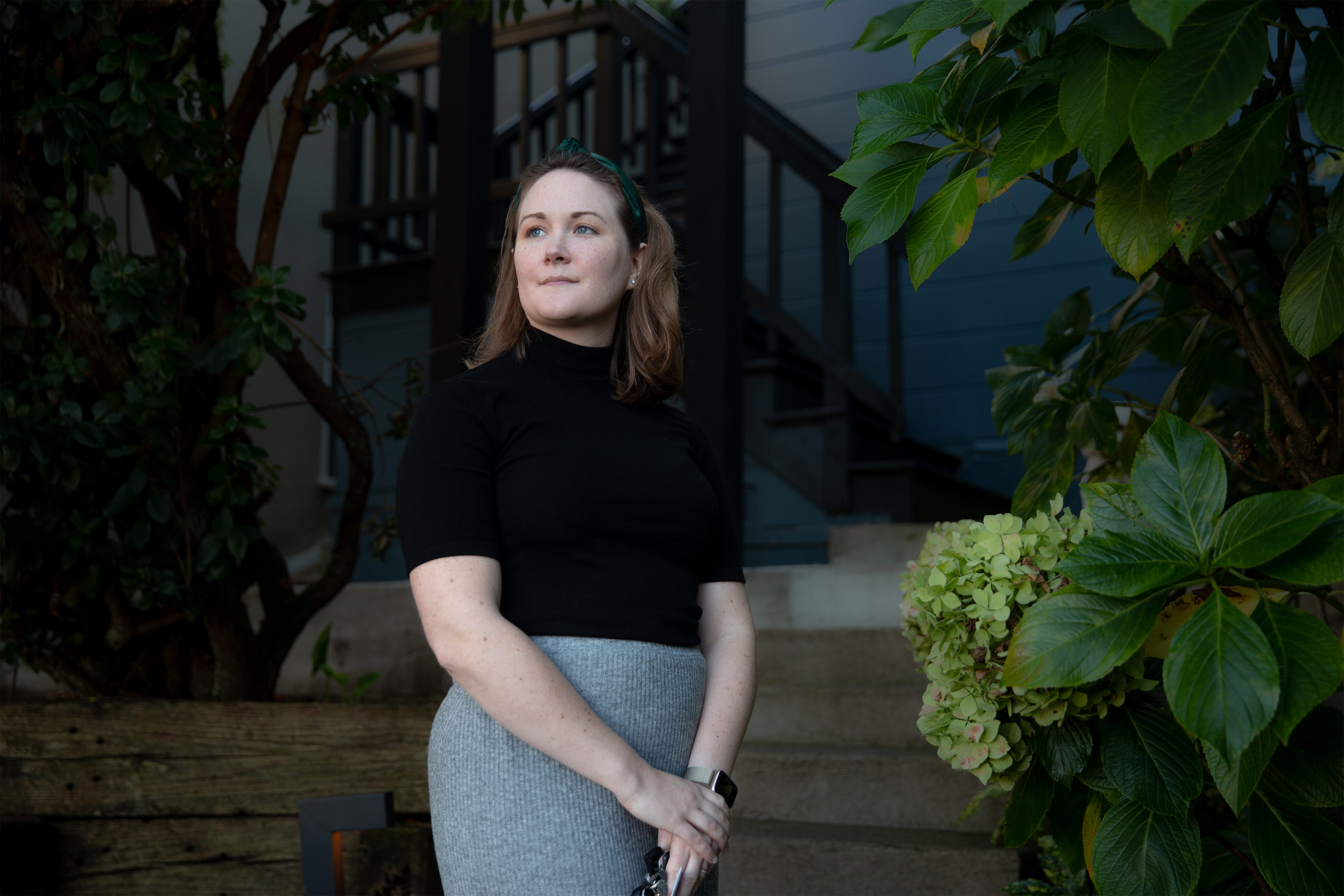 A photo shows Grace E. Elliott posing for a photo outside.