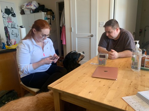 A photo shows Elizabeth Fisher Smith at home with her husband.