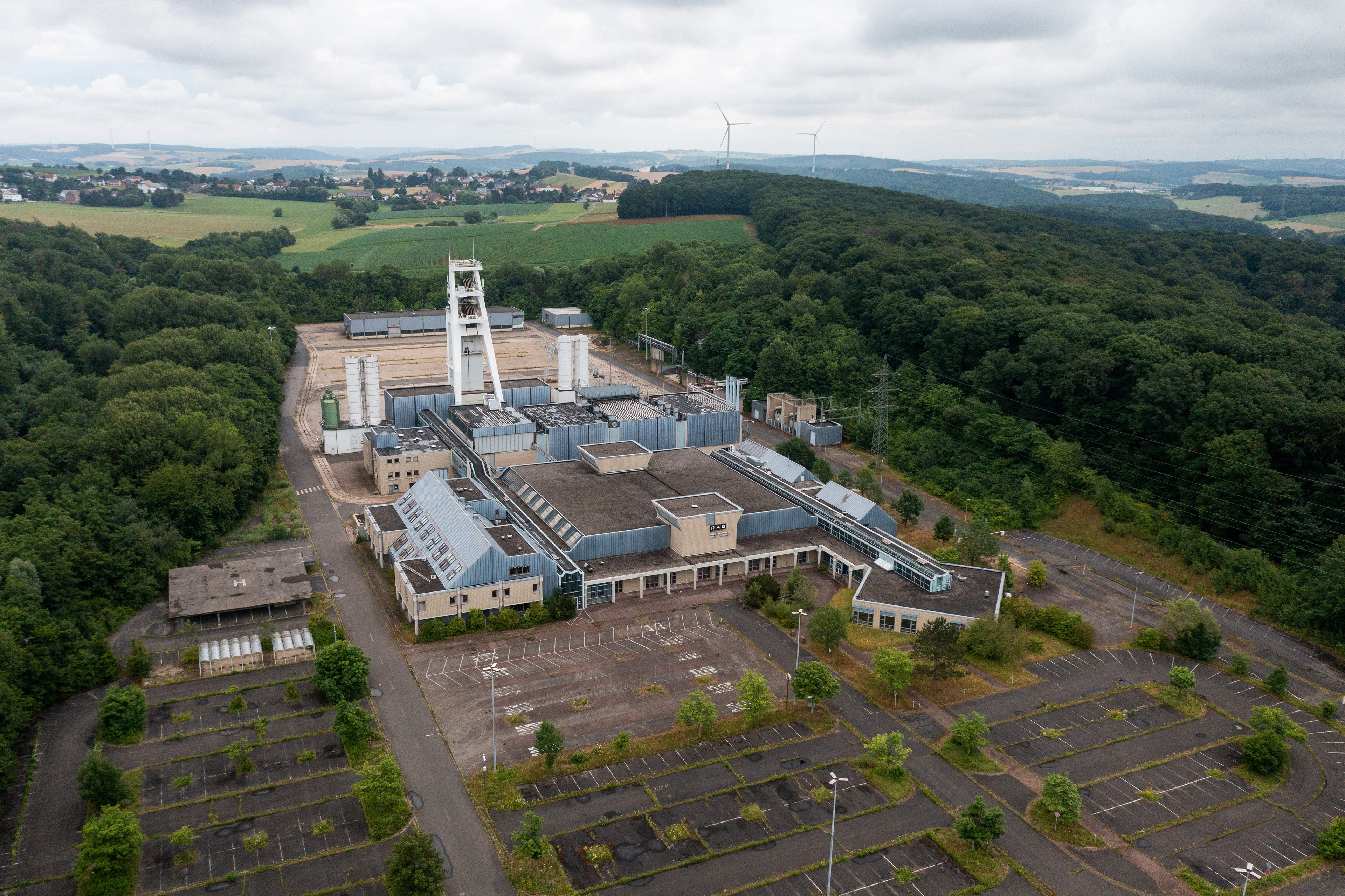 A photo shows an aerial view of the abandoned Bergwerk Saar coal mine in Germany.
