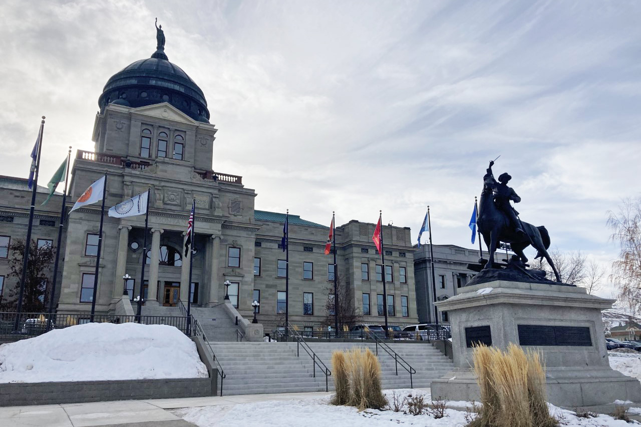 A photo shows the exterior of Montana's Capitol.