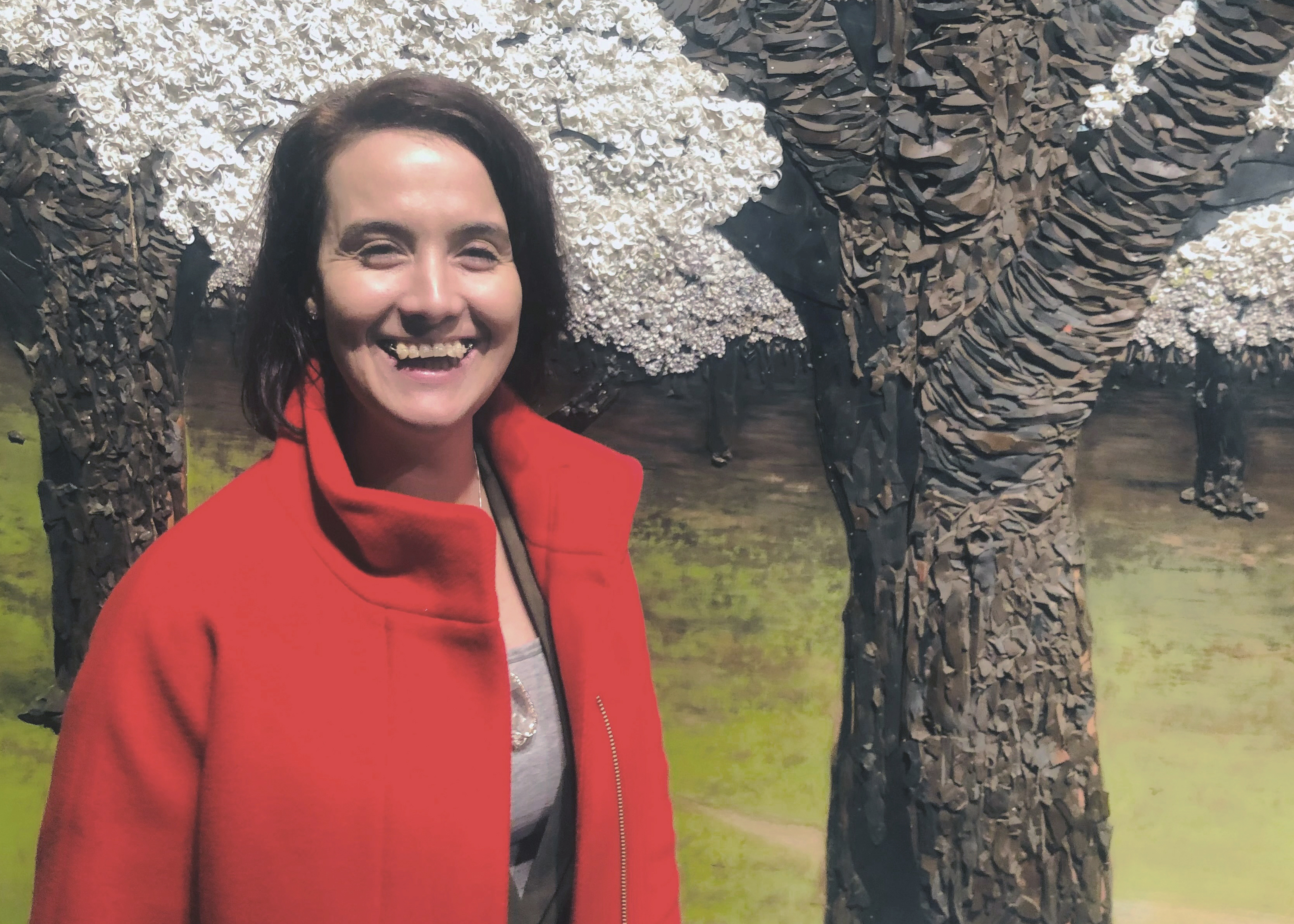 A photo of Boja Kragulj outside, similing and showing her teeth.