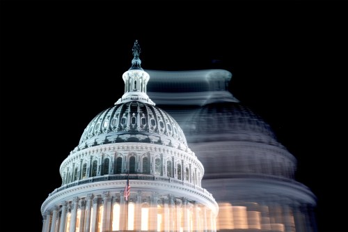 A photo of the U.S. Capitol building against a dark sky.