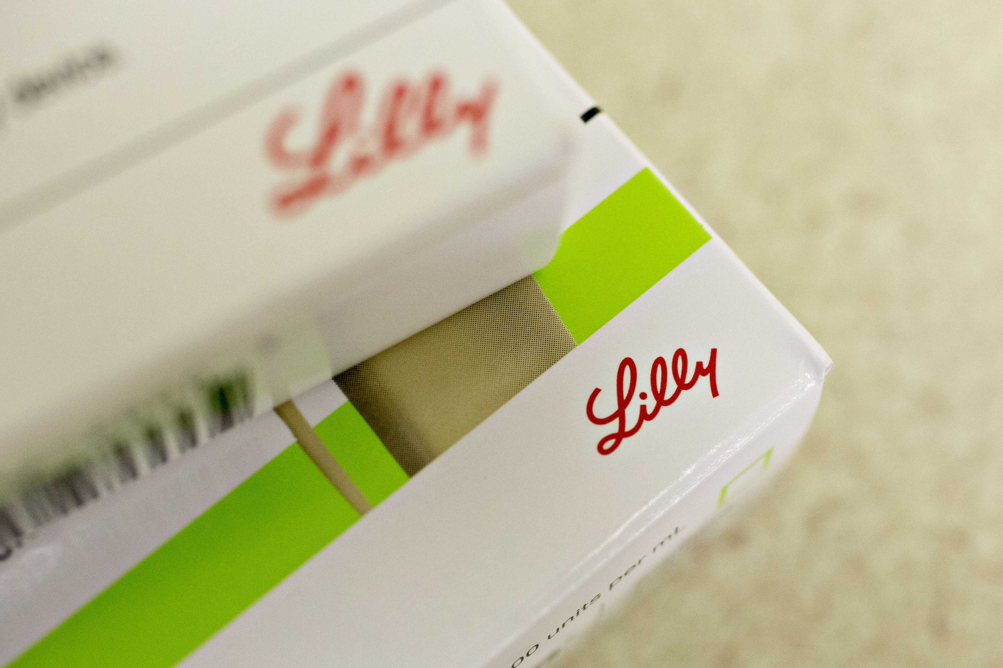 An Eli Lilly & Co. logo is seen on a box of insulin medication in this arranged photograph.