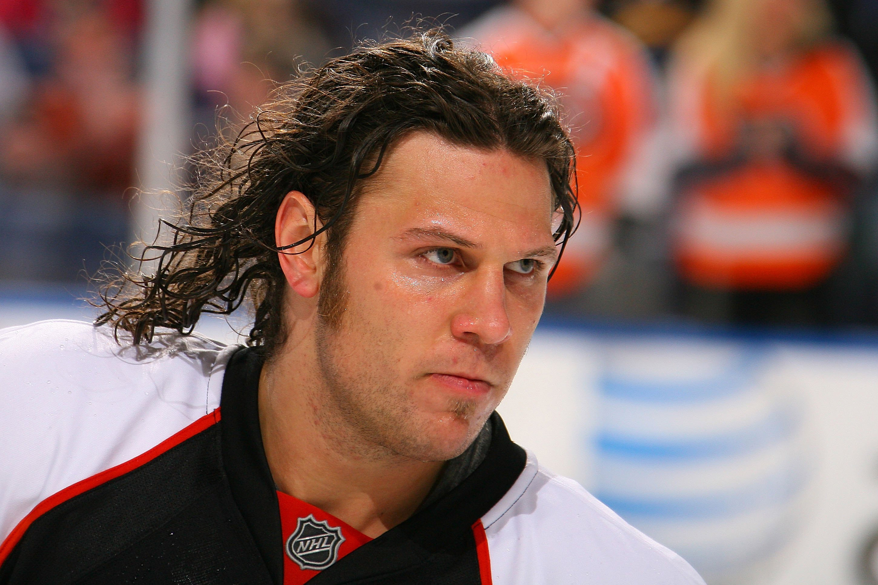 A photo of a younger Riley Cote skating before an ice hockey match in 2009.