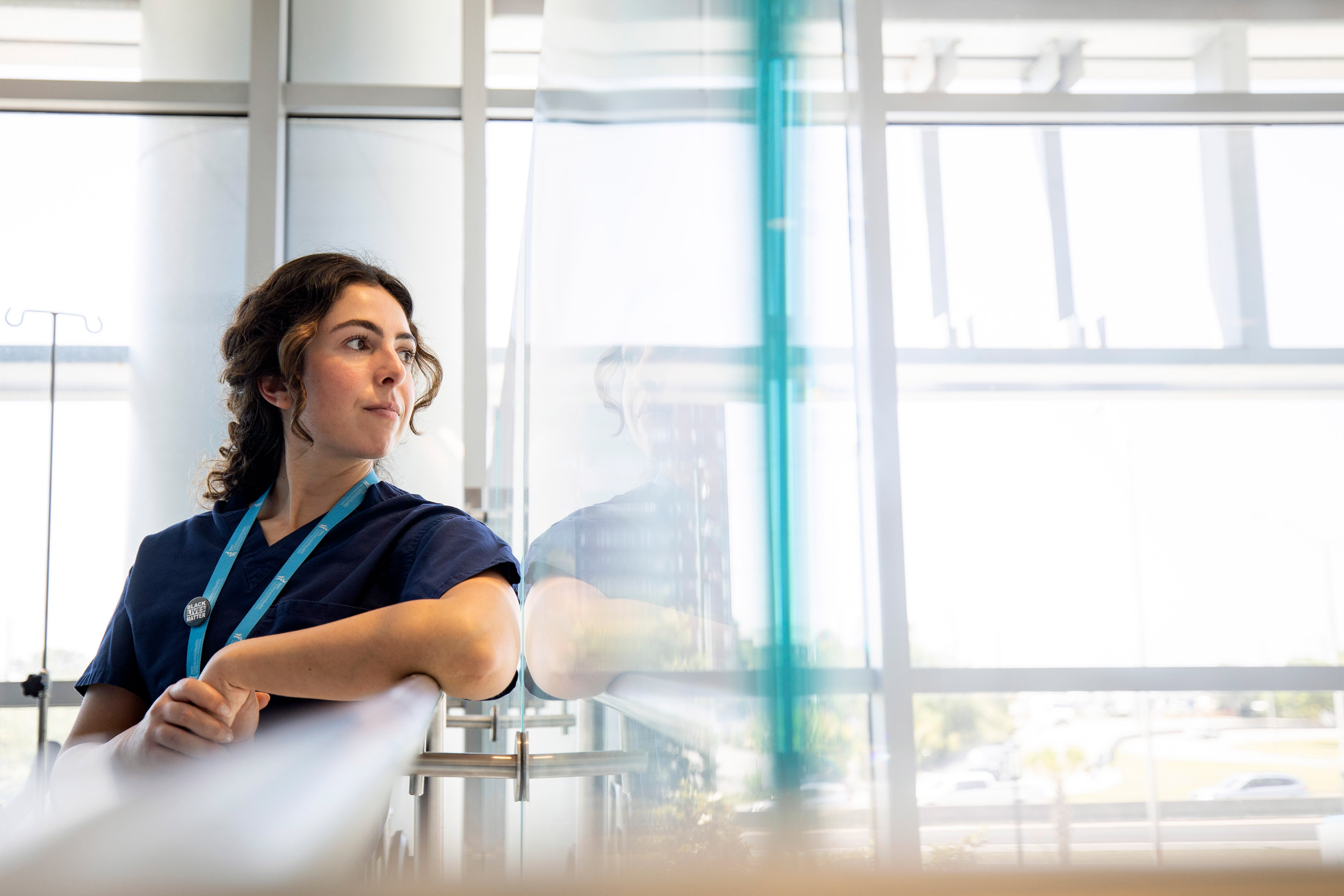 A photo of Melanie Gray Miller posing for portrait indoors.
