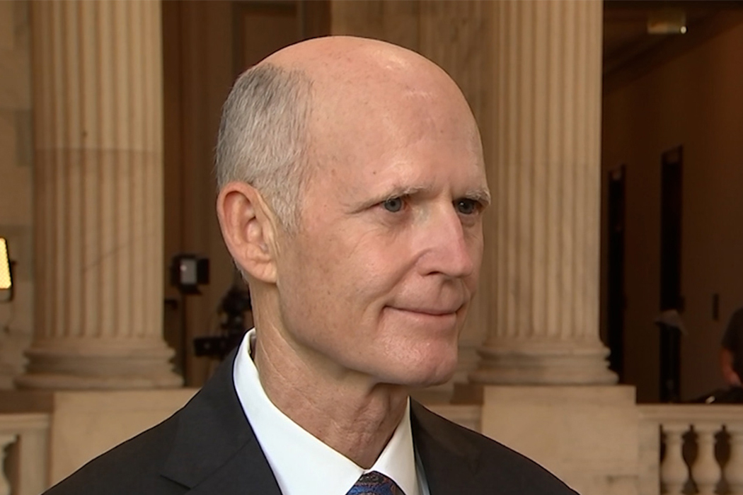 A photo of Senator Rick Scott being interviewed in the U.S. Capitol.