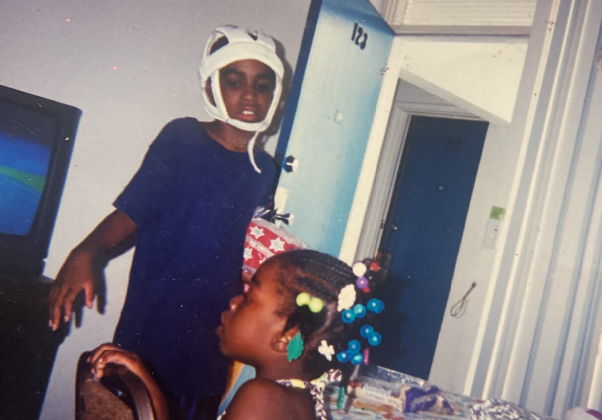 An old photo shows a young Oronde McClain with his sister.