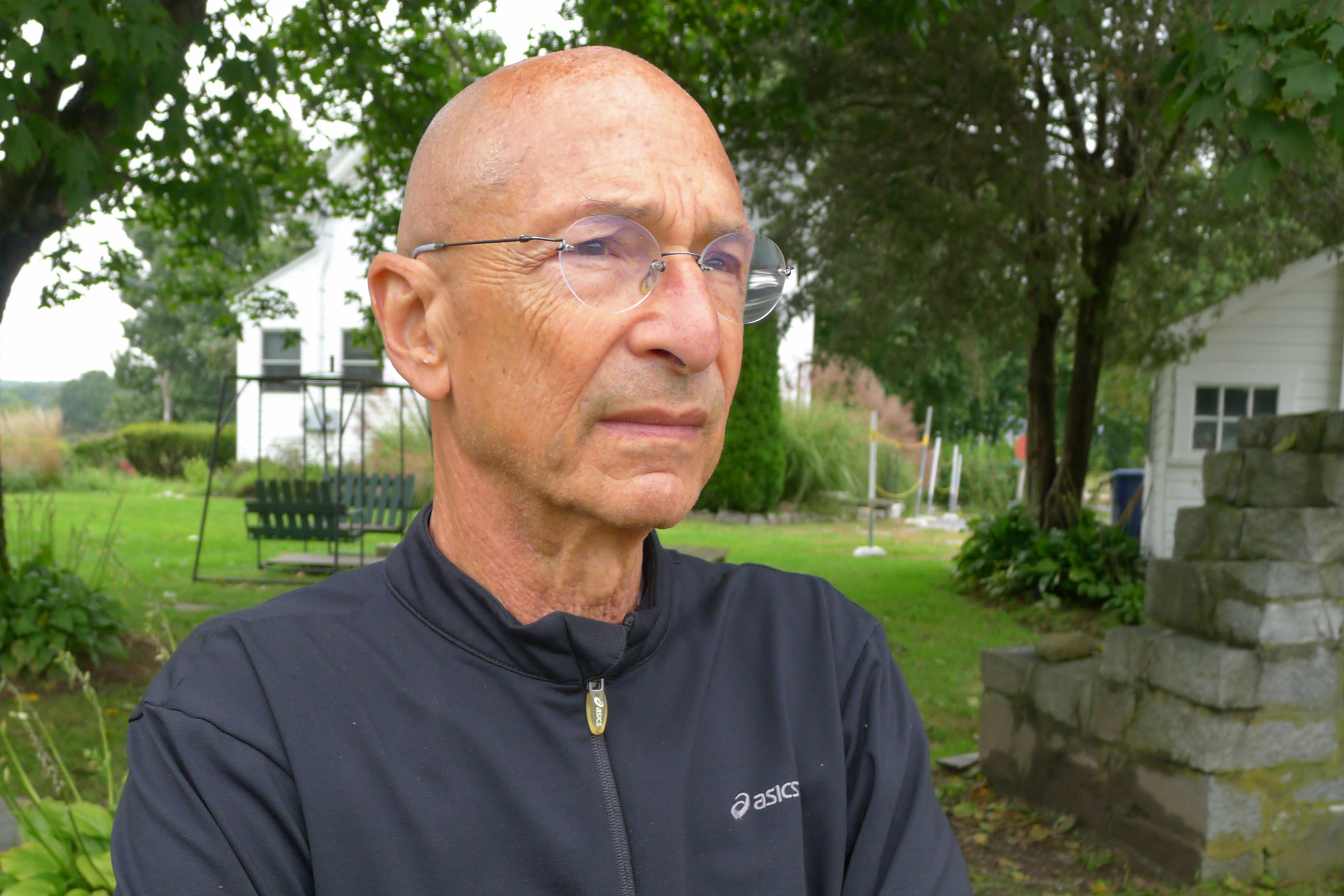 A portrait of a man outside.