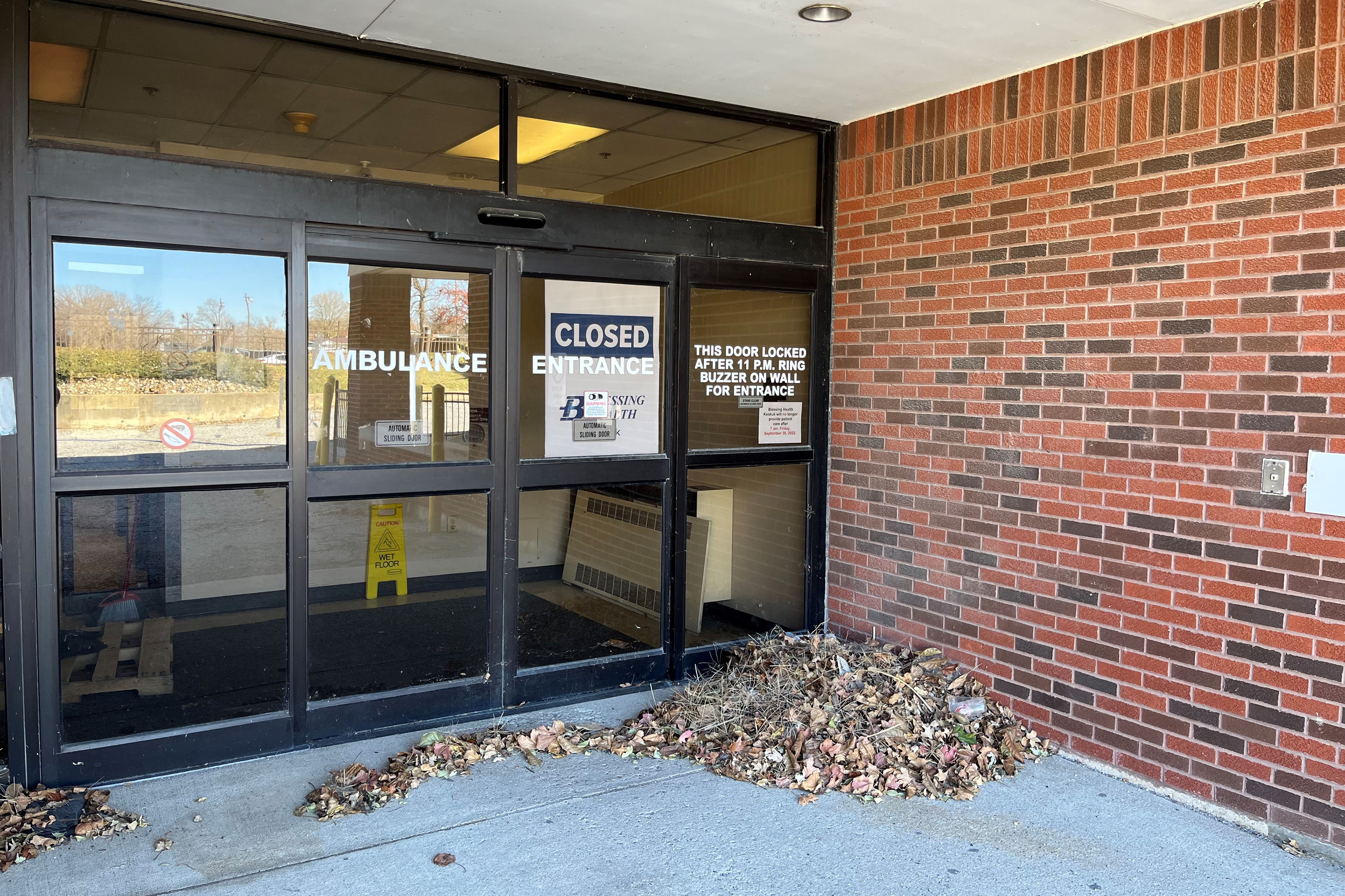 The former ambulance entrance at the Keokuk Area Hospital has a large sign that says "closed" taped to the inside of the automatic doors.