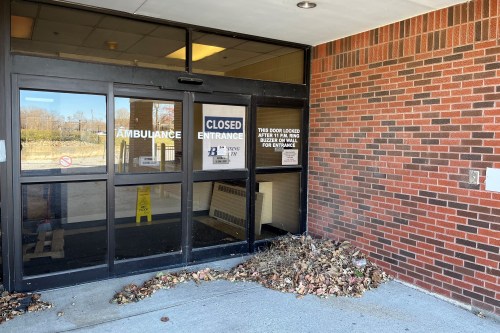 The former ambulance entrance at the Keokuk Area Hospital has a large sign that says "closed" taped to the inside of the automatic doors.