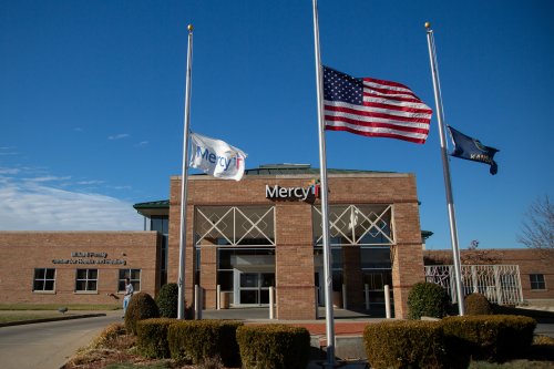 A photo of a hospital flying its flags at half staff.