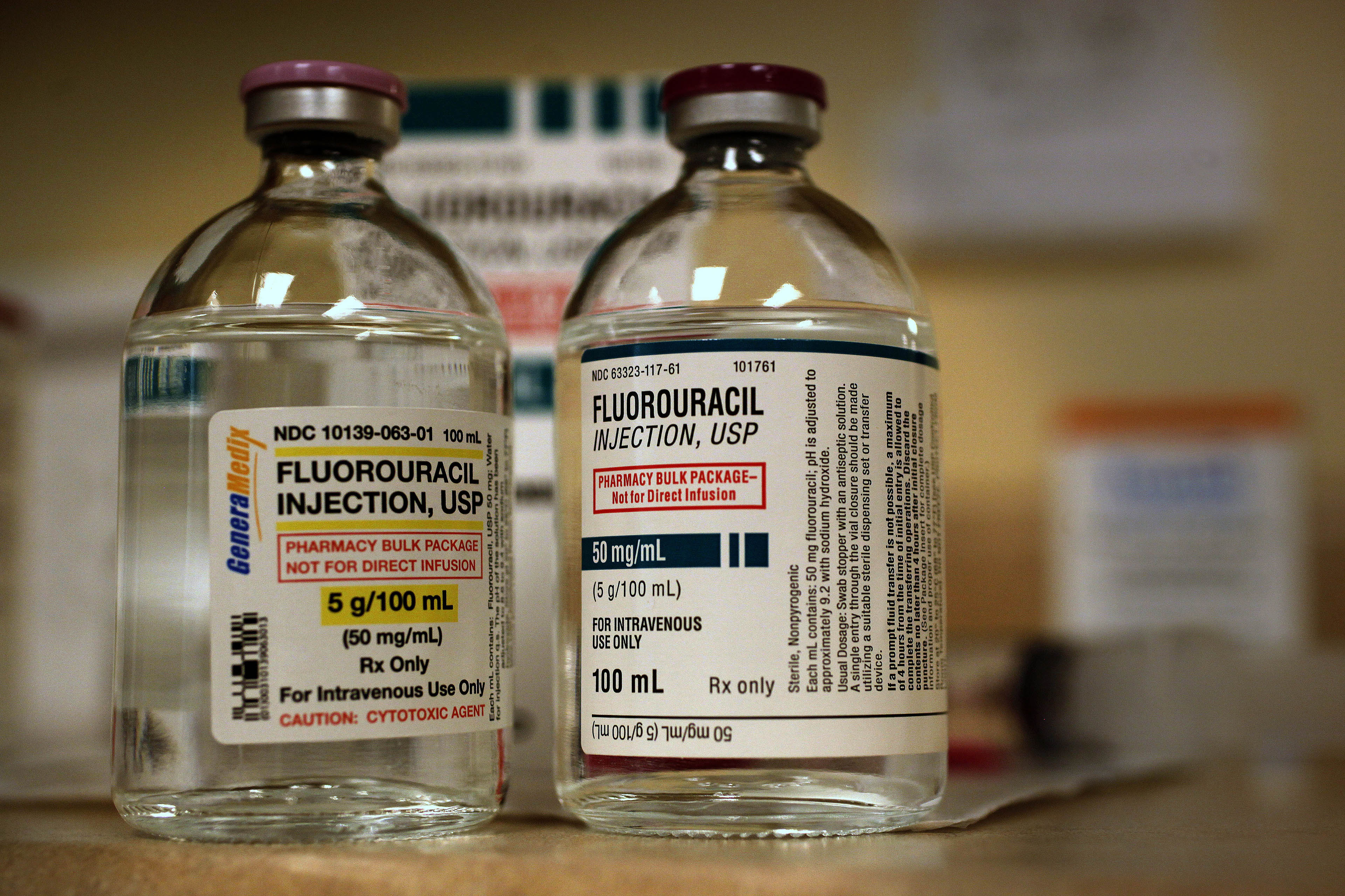 Two vials of Fluorouracil. The liquid inside the glass vials are clear.