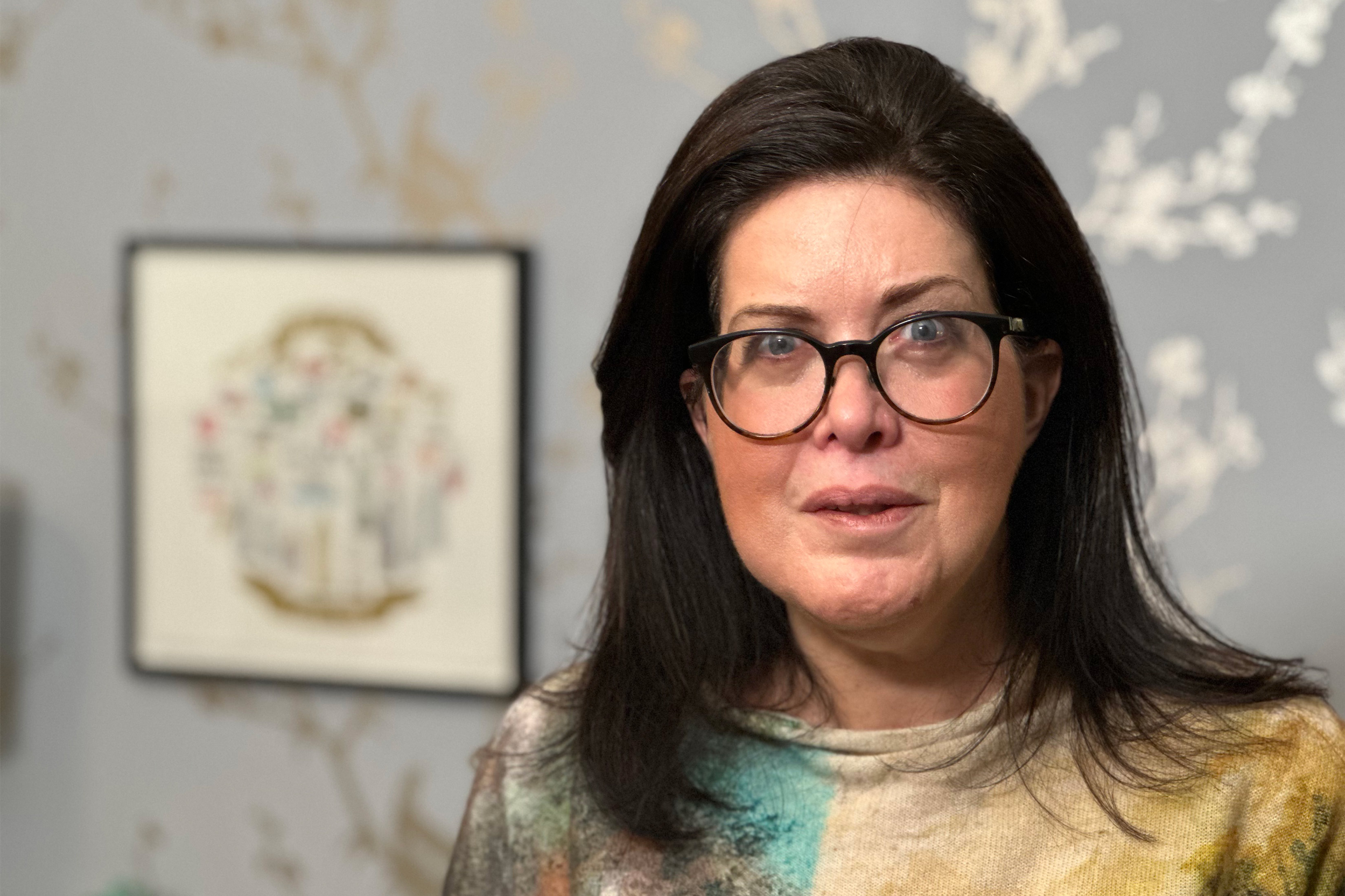 A photo of Jenny Feldman smiling indoors.