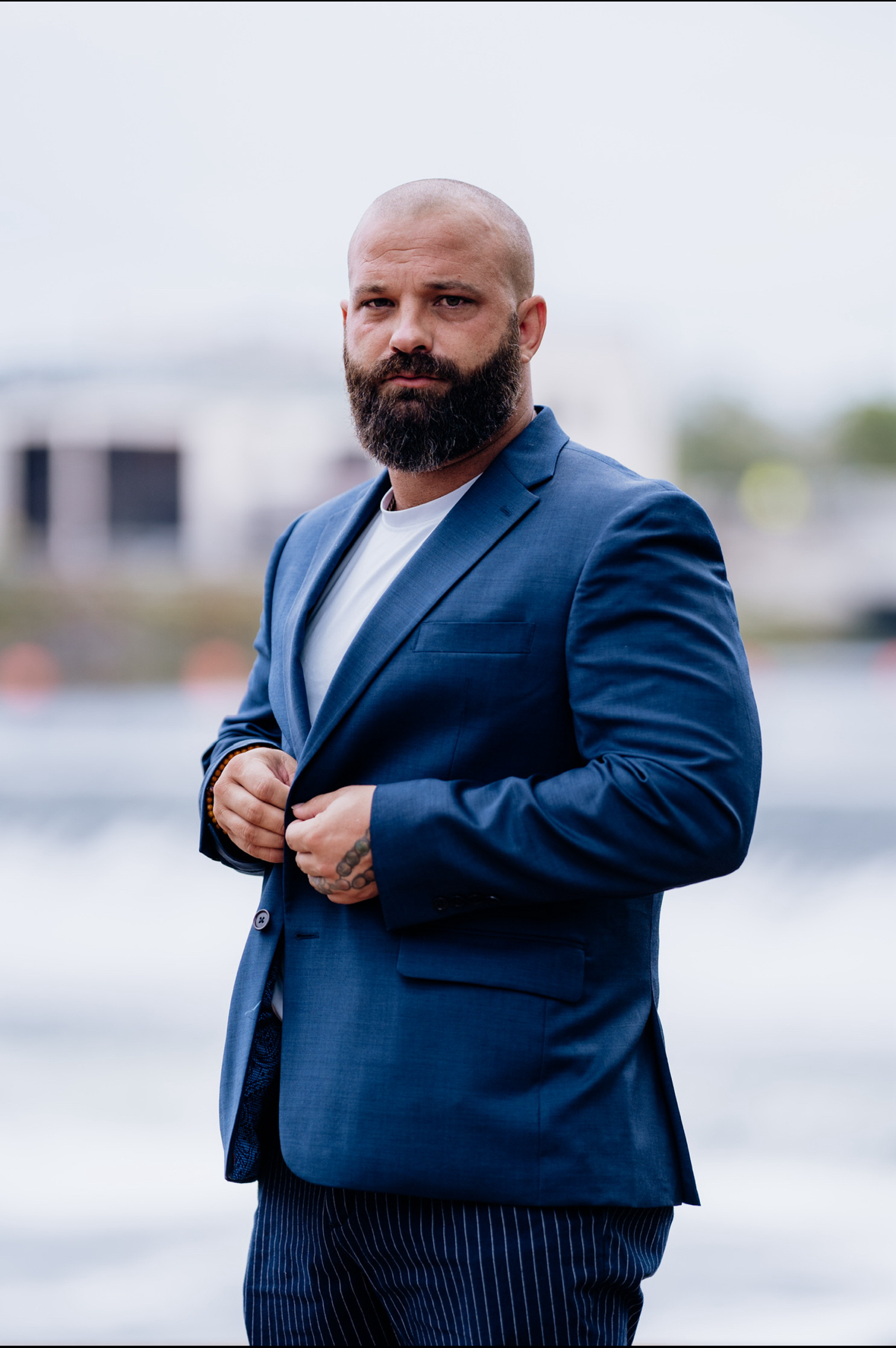A portrait of Phil Stucky. He is wearing a blue suit.