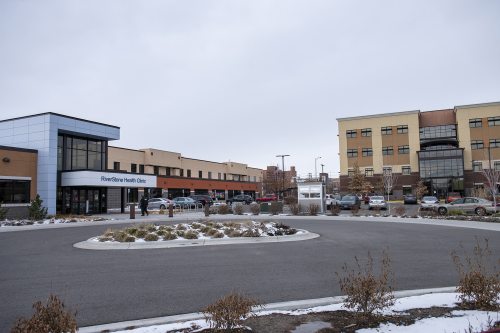 An exterior of a clinic building from the parking lot.