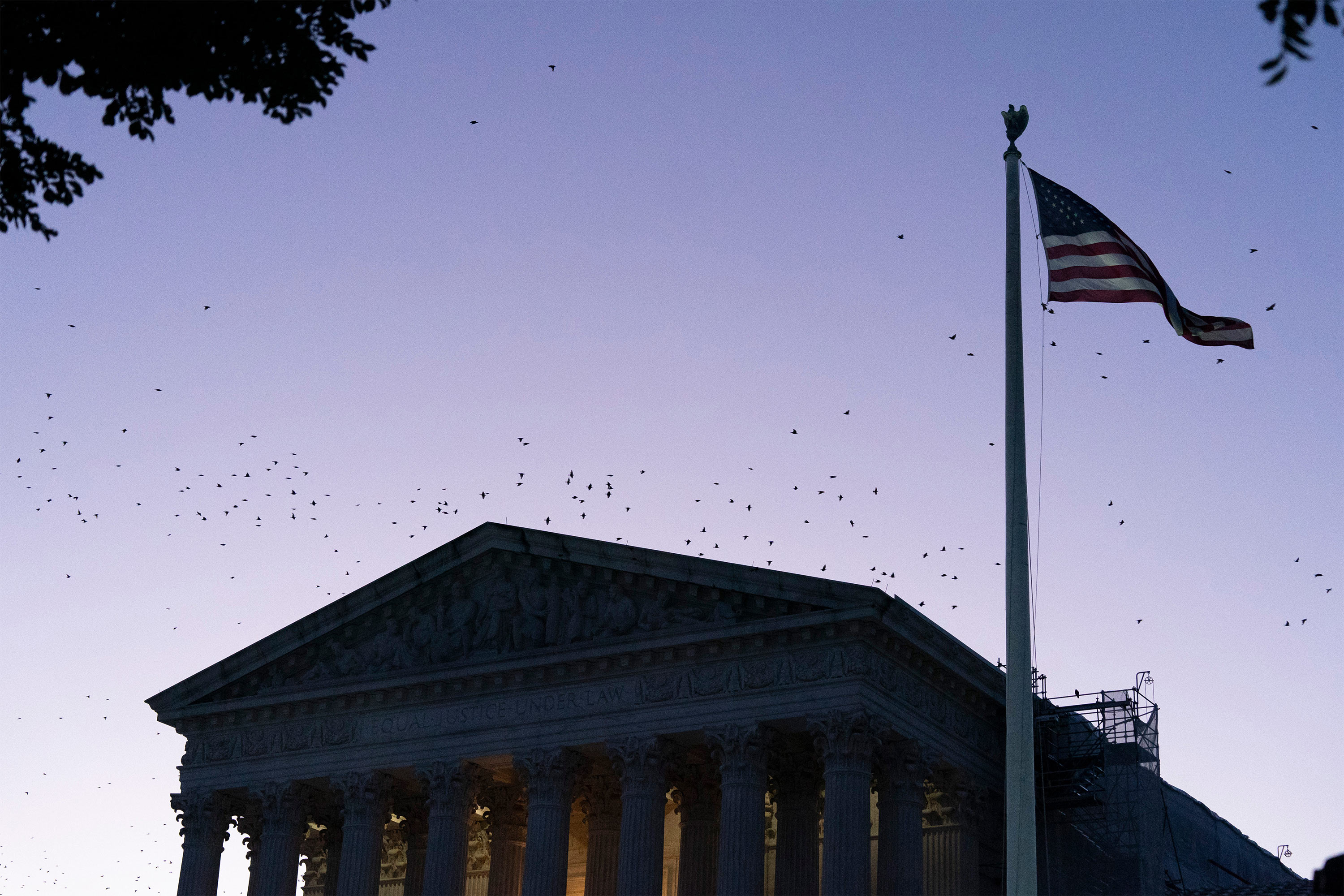 A photo of the Supreme Court's exterior at sunrise.
