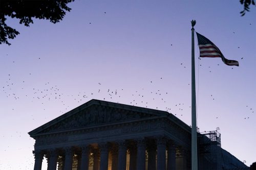 A photo of the Supreme Court's exterior at sunrise.