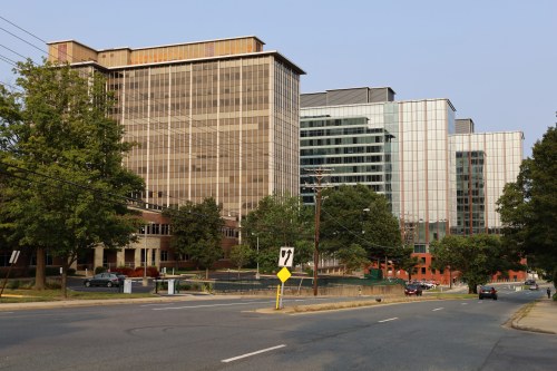 A photo taken from the street of a large, modern office building in Rockville, Maryland.