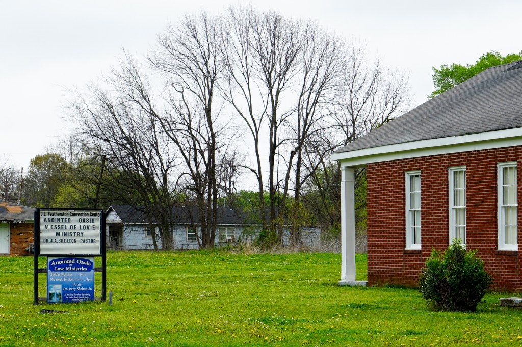 The exterior of a red-brick church.