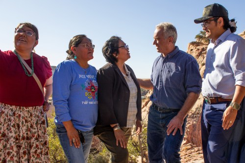A photo of Navajo tribal members meeting with Robert F. Kennedy Jr. outside.