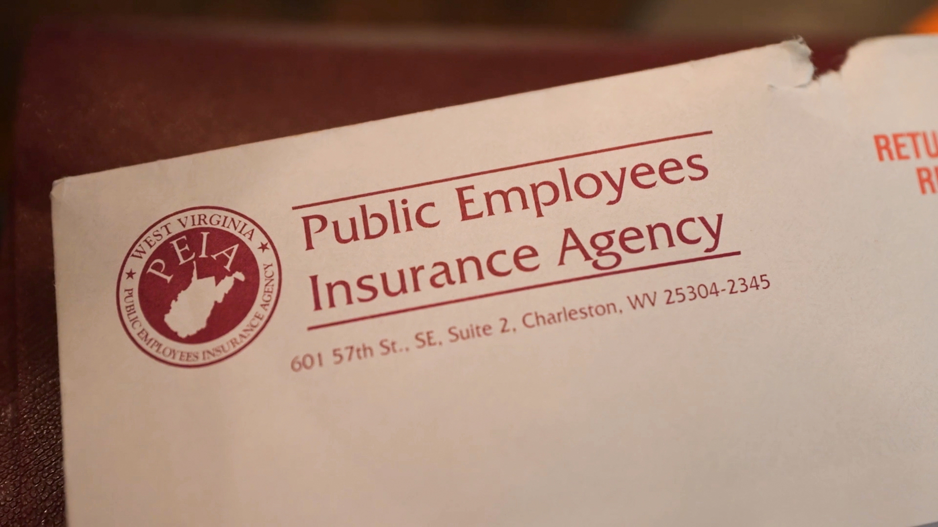A photo of an envelope with West Virginia’s Public Employees Insurance Agency's logo printed on it.