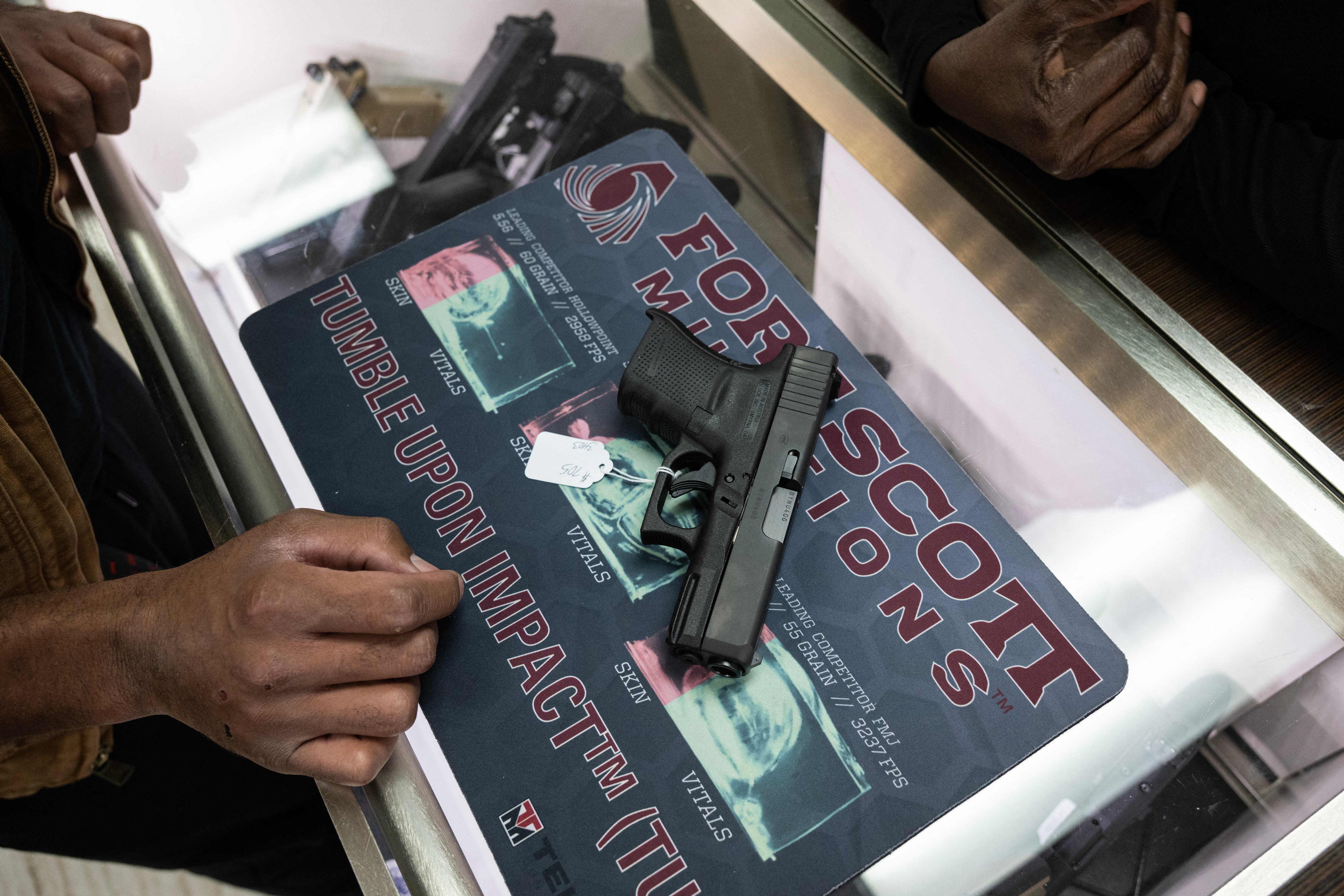 A photo of a gun on the counter at a gun shop in Maryland.