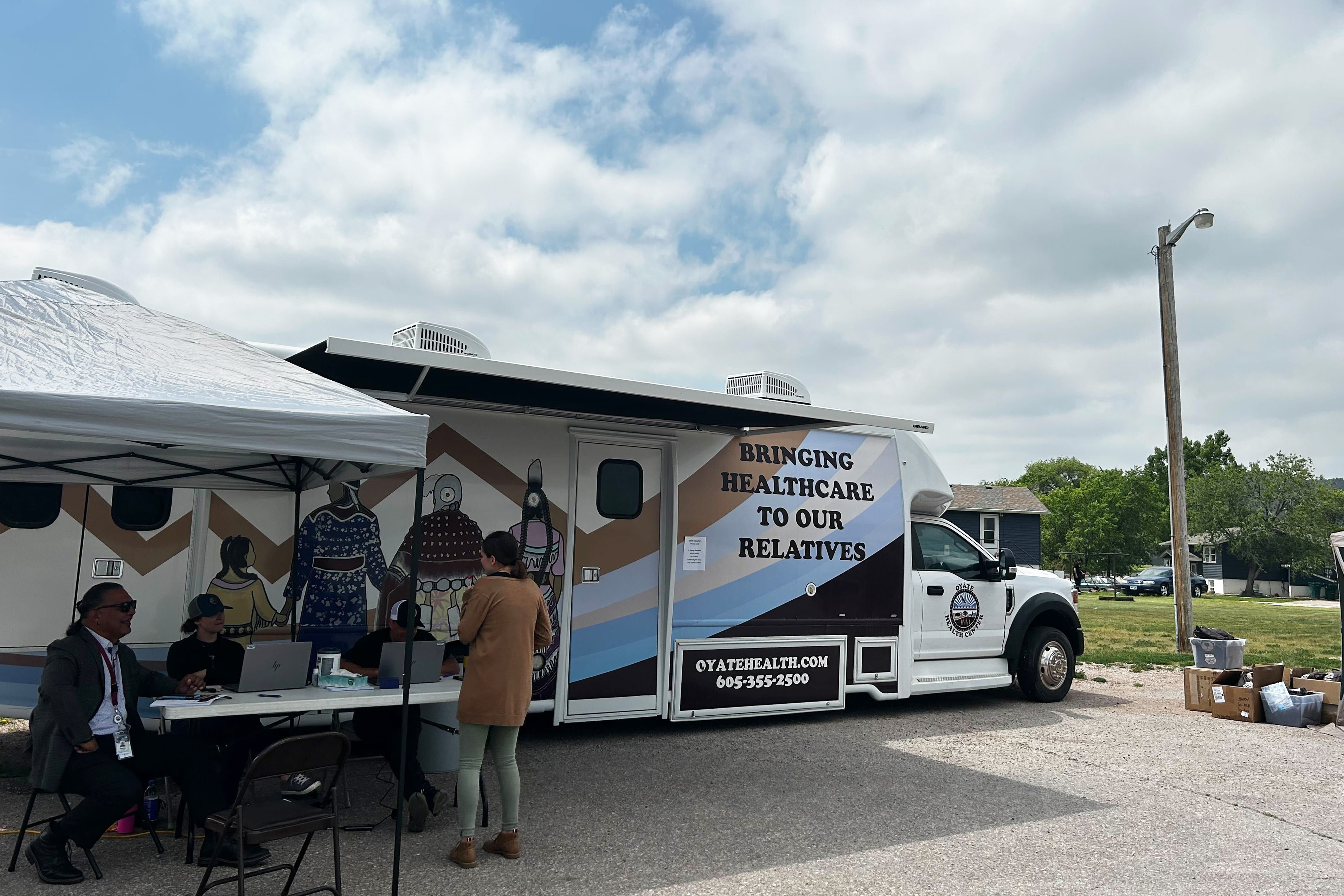A photo of a mobile clinic parked outside.