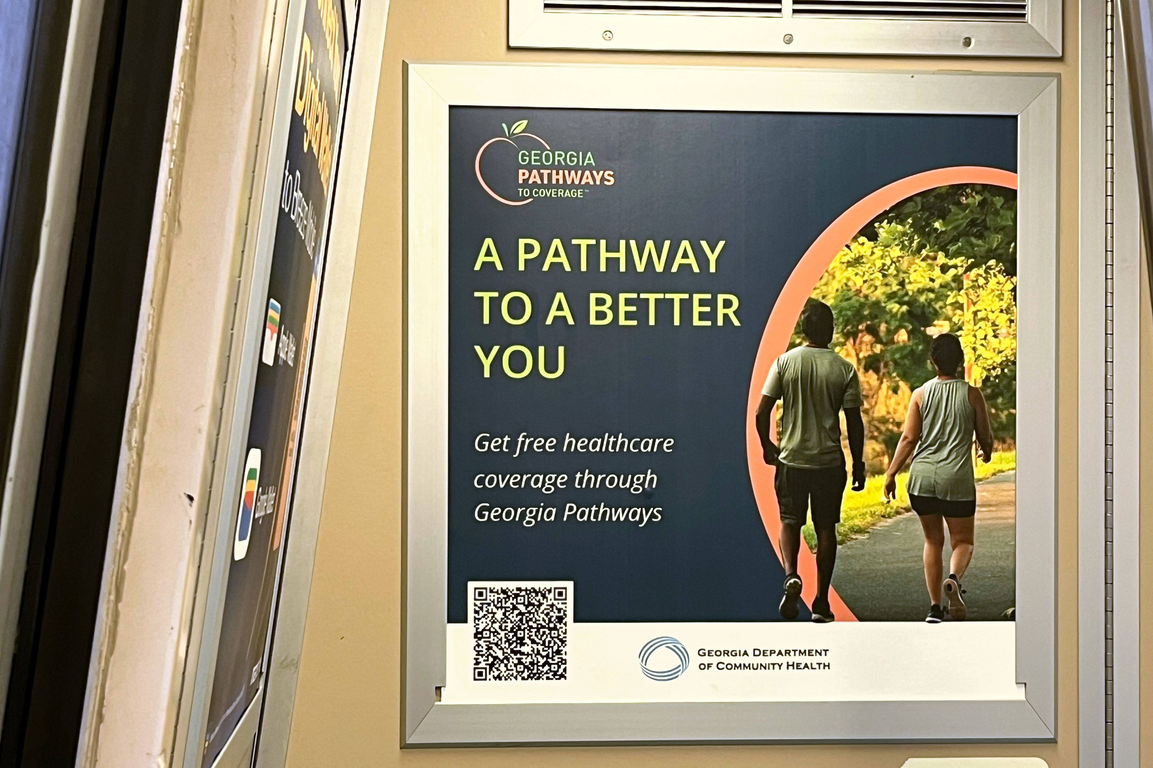 A photo of a train advertisement that reads, "A pathway to a better you. Get free healthcare coverage through Georgia Pathways."