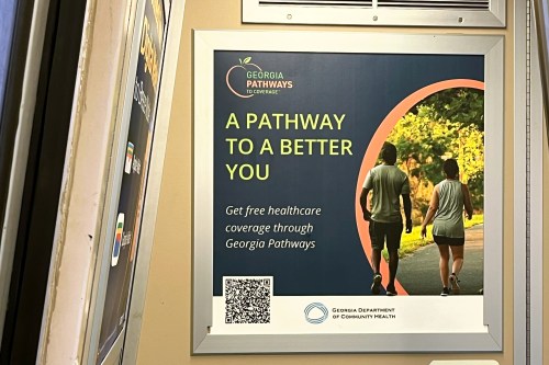 A photo of a train advertisement that reads, "A pathway to a better you. Get free healthcare coverage through Georgia Pathways."