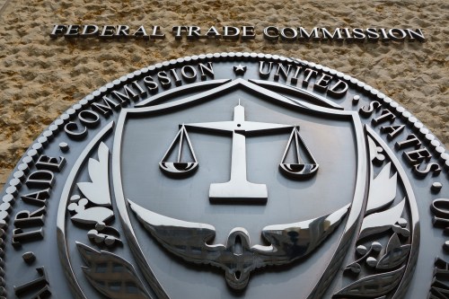 A photo of the Federal Trade Commission's logo on the outside of a building.