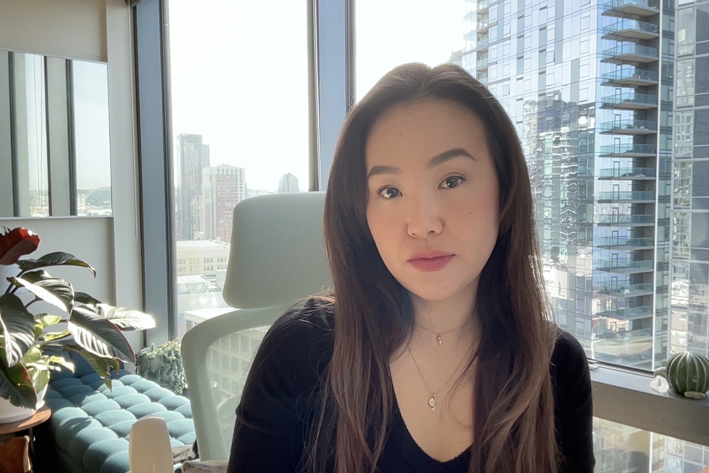 A photo of a young woman indoors.