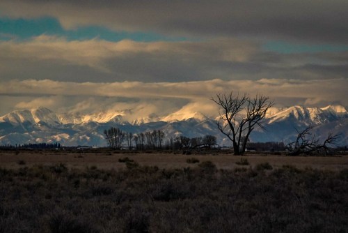 A landscape photograph of a mountain-scape in Colorado at sunset.