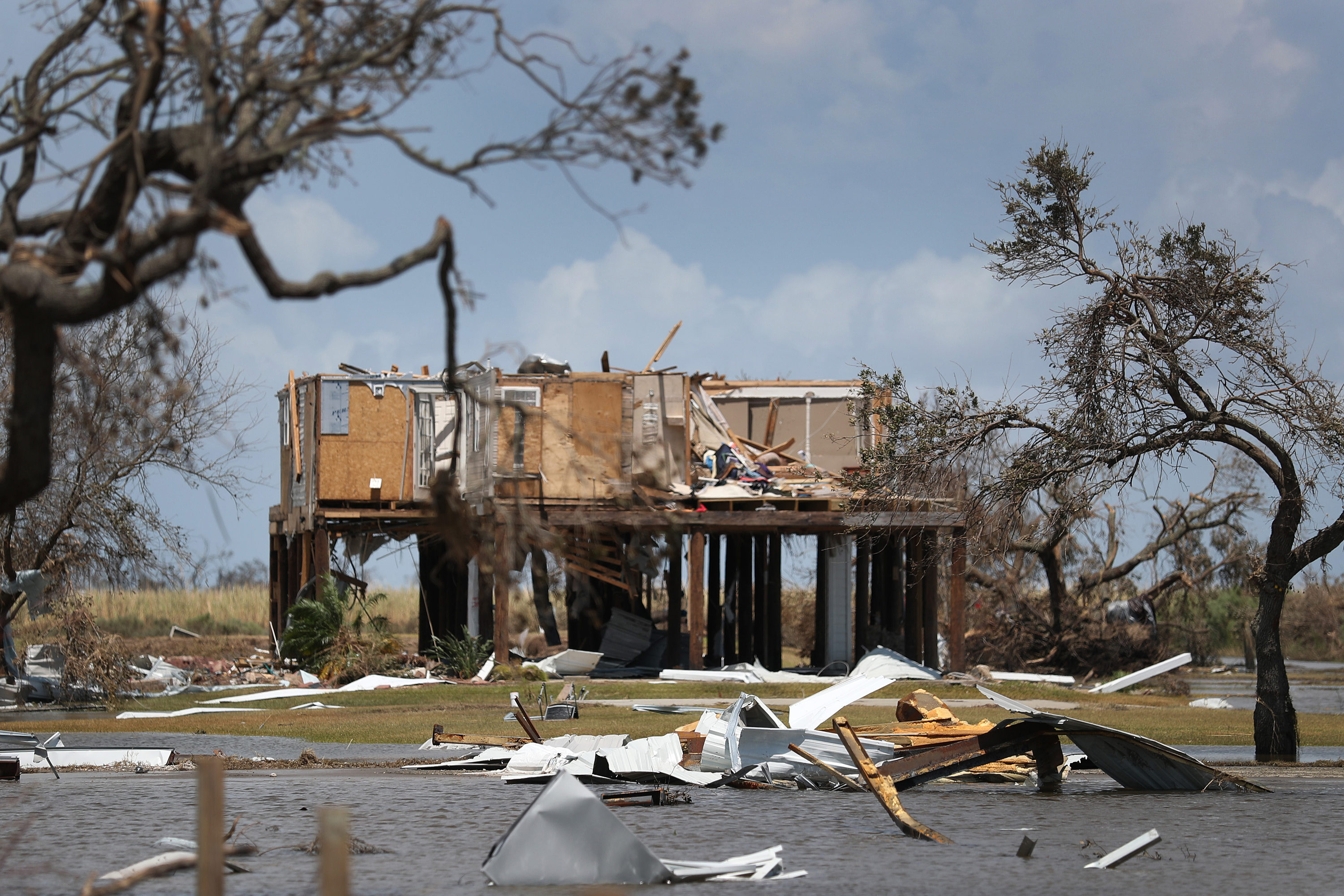 A photo of a house damaged by a hurricane.