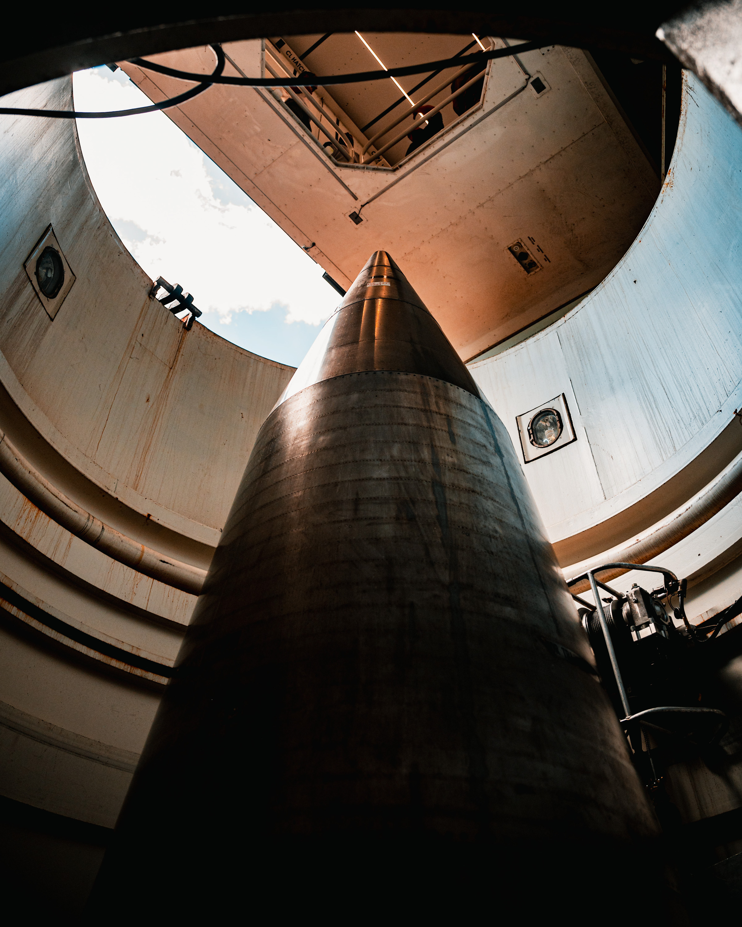 A photo of a large nuclear missile in a silo.