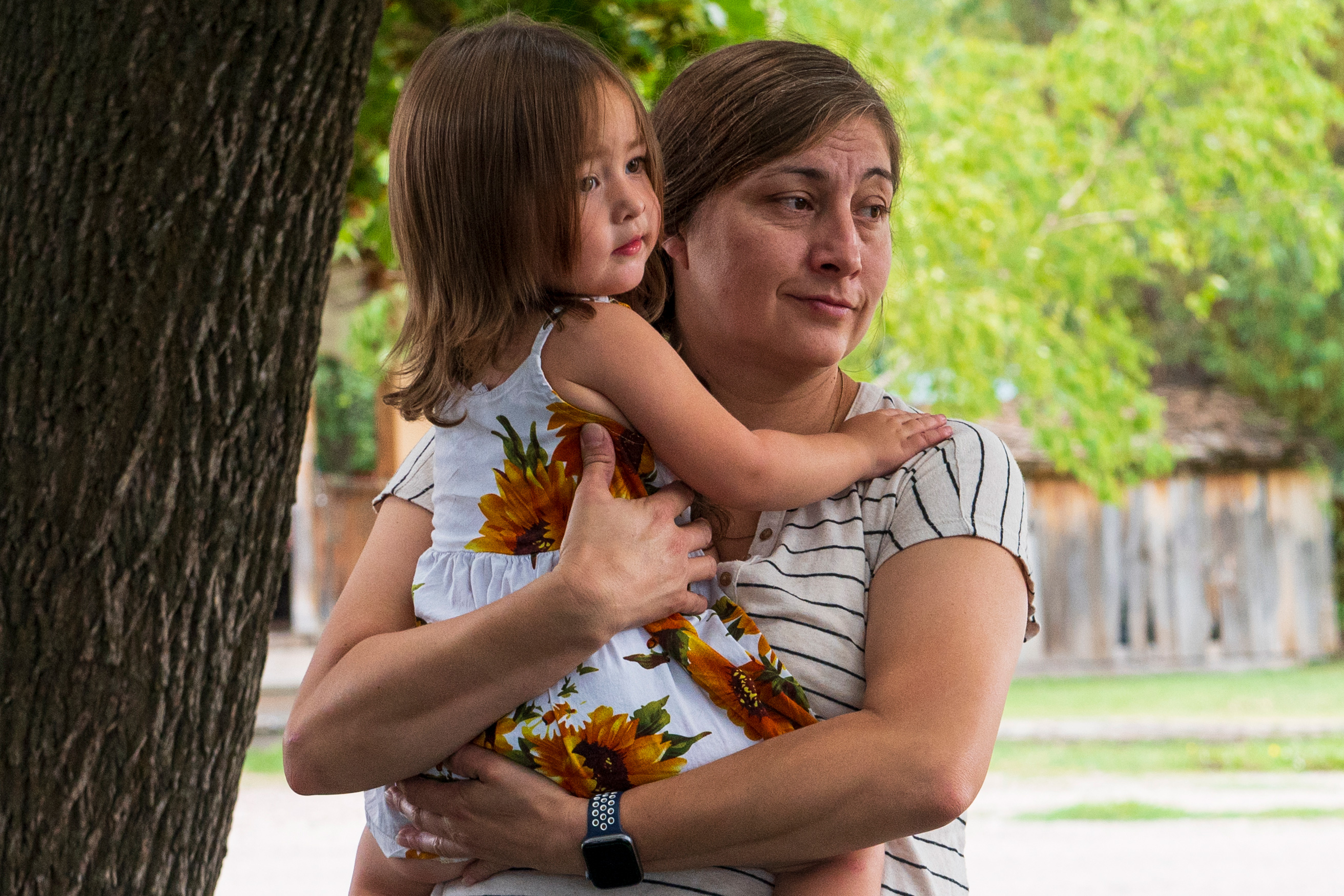 A photo of a Native American mother holding her daughter.