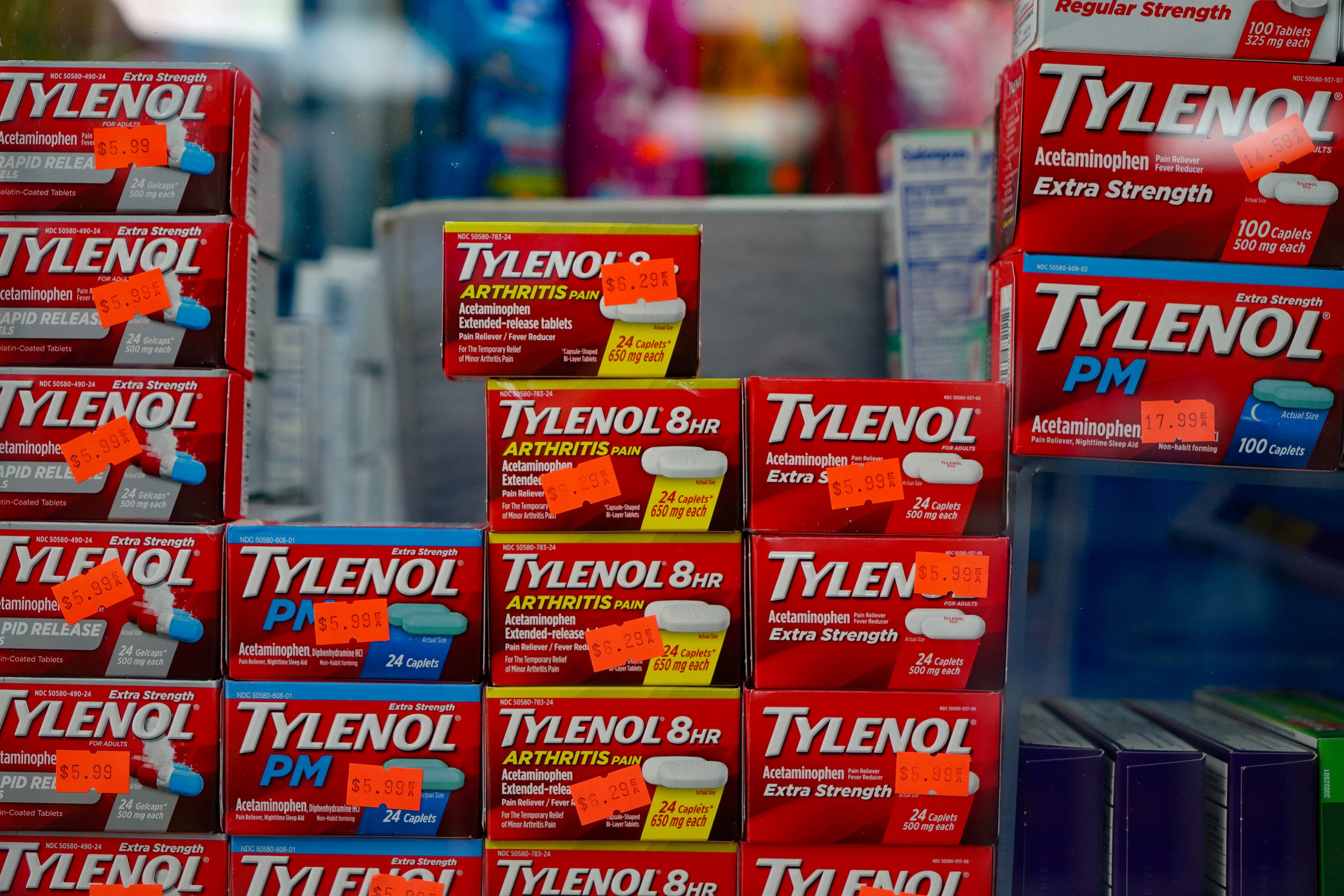 Boxes of Tylenol with price stickers sit on a shelf