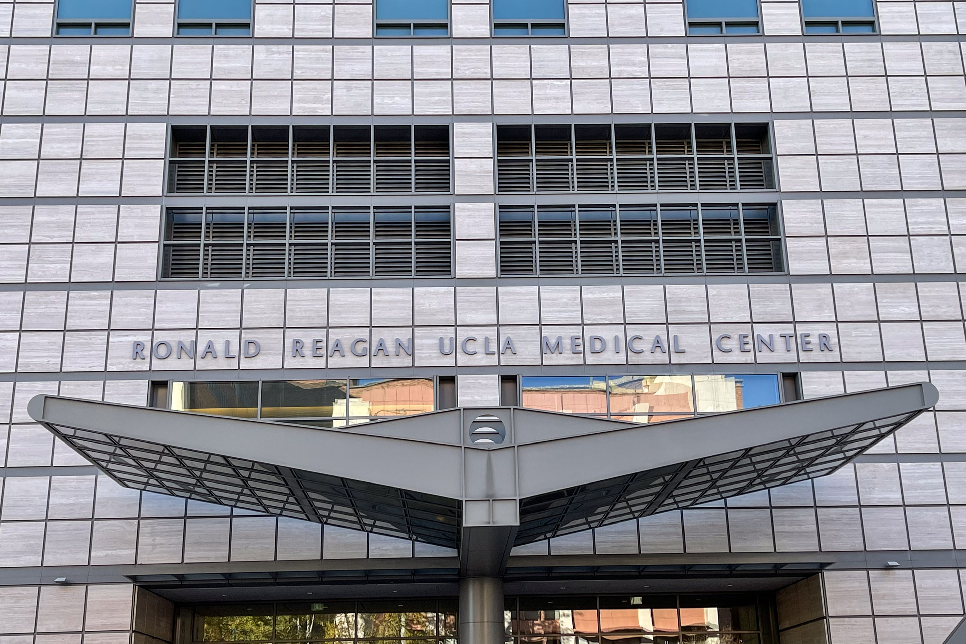 A building entrance with signage that says "Ronald Reagan UCLA Medical Center"