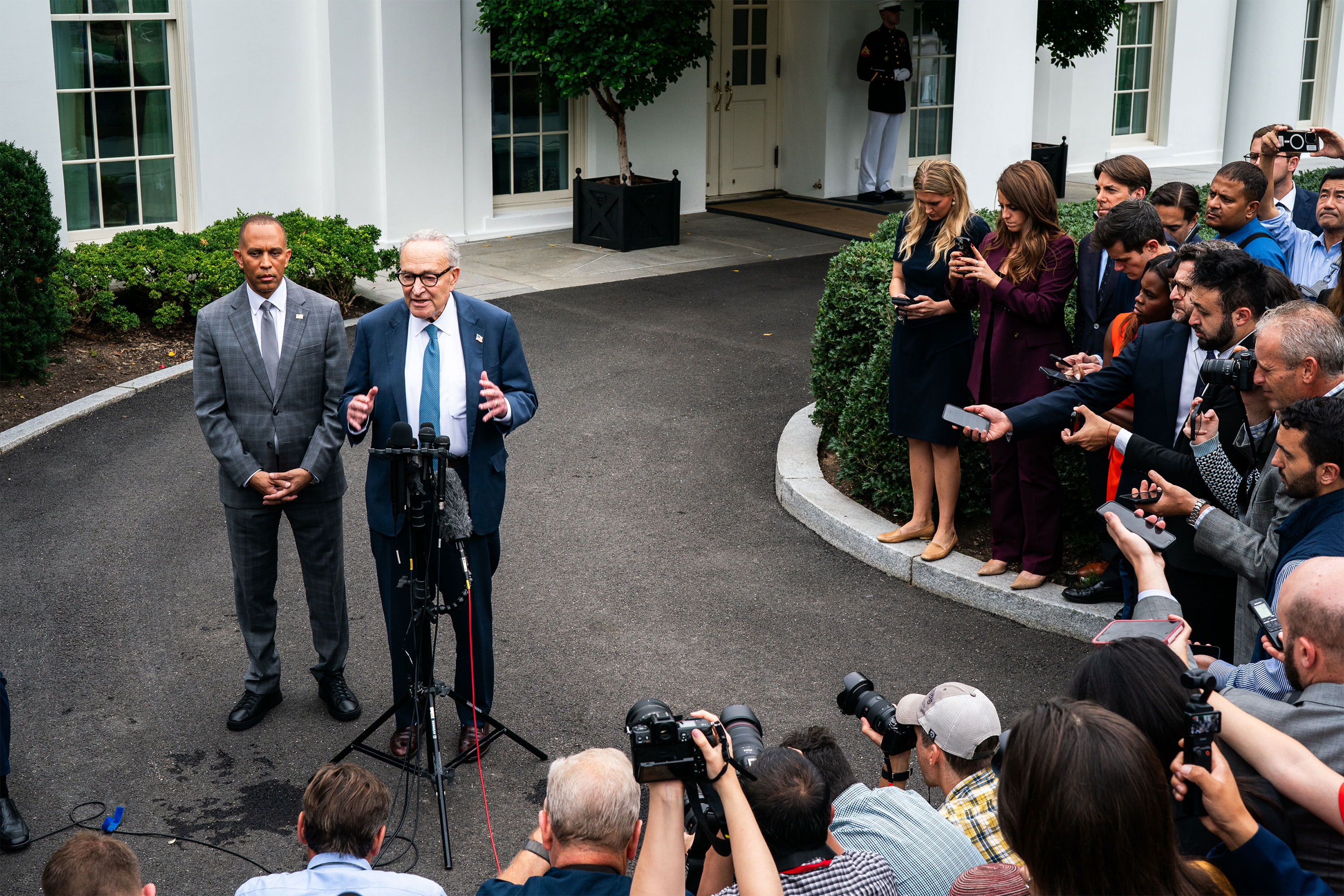 A photo of Hakeem Jeffries and Chuck Schumer holding a news conference.