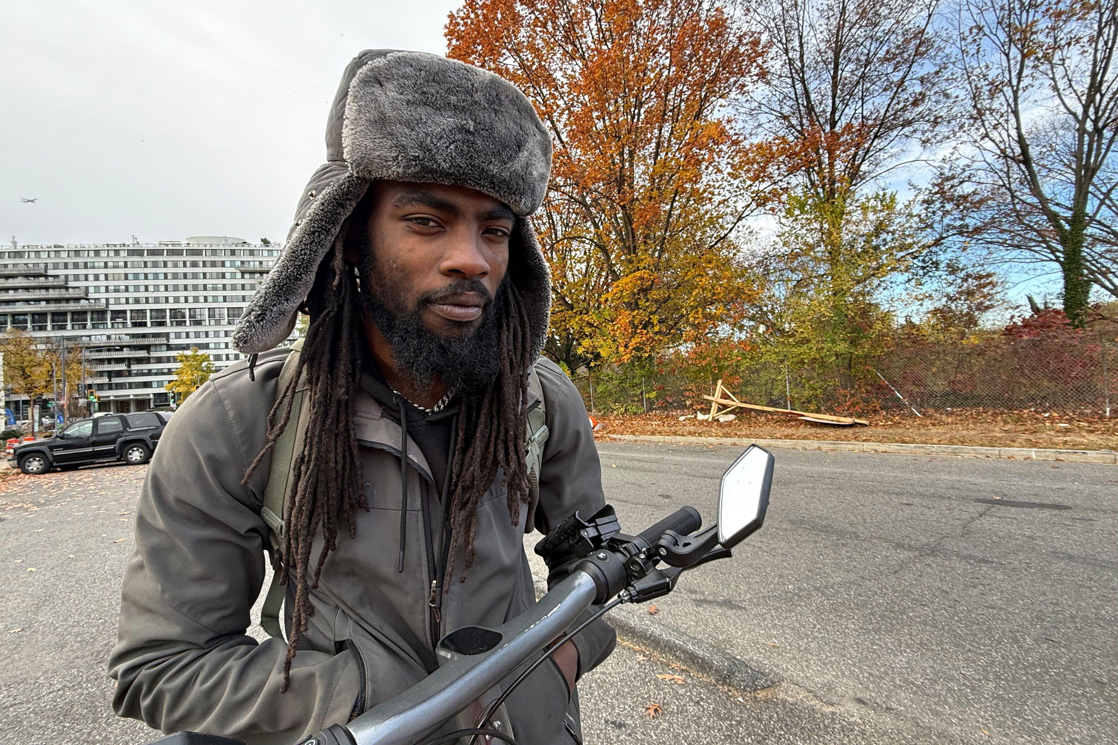 A photo of a Black man in winter clothes outside in D.C.