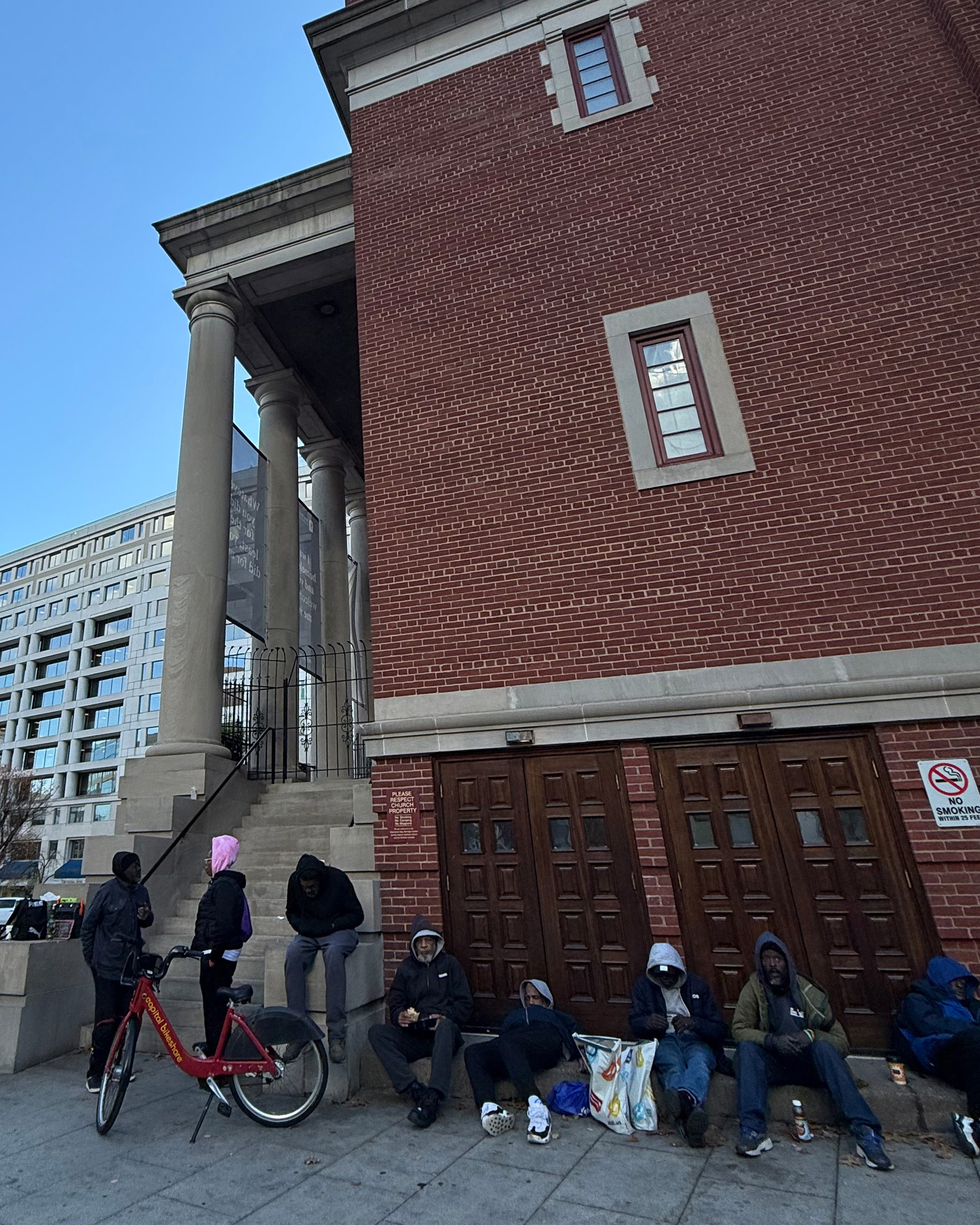 A photo of people seated in a row at a church.