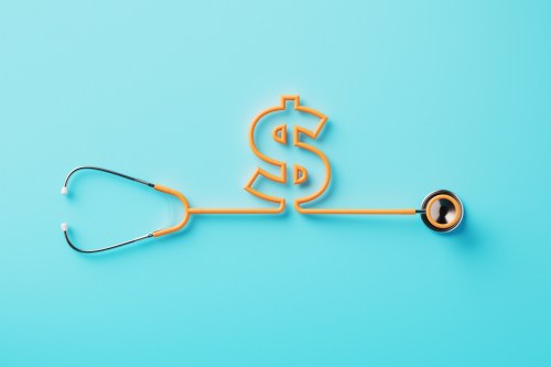 Orange stethoscope forming a dollar sign on blue background.