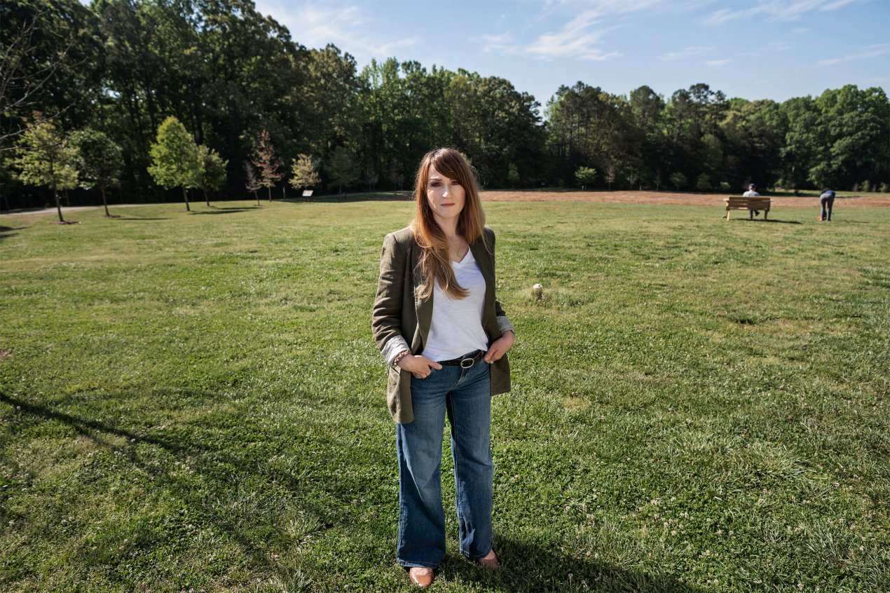 Silvana Toska stands in a grassy field at a park.