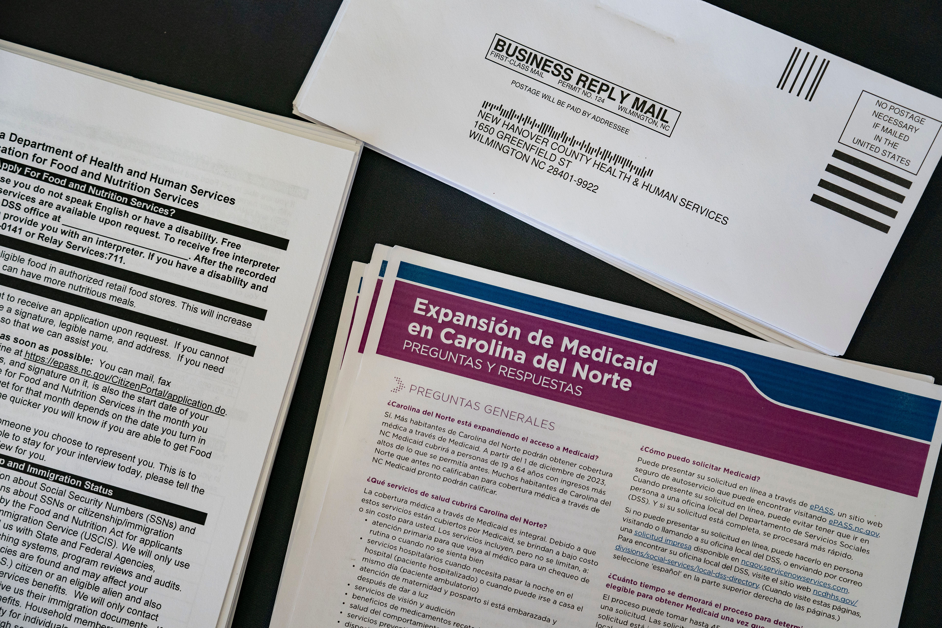 Paperwork related to Medicaid in North Carolina is seen laid out