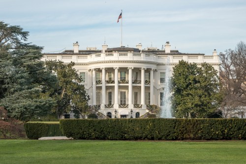 An exterior shot of the White House at daytime.